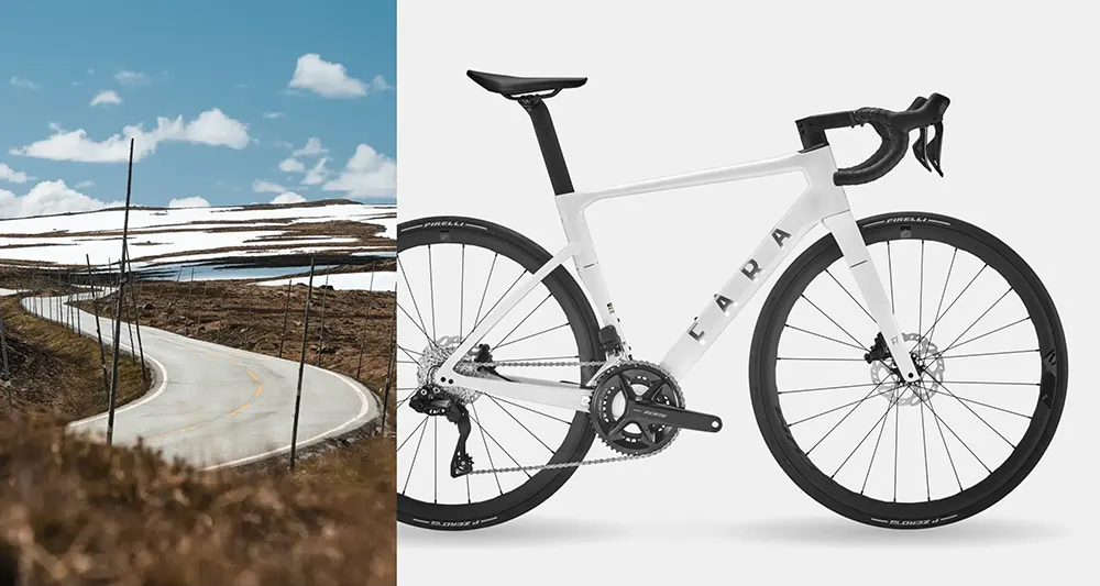 An Fara all-round performance road bike next to a rugged mountain road